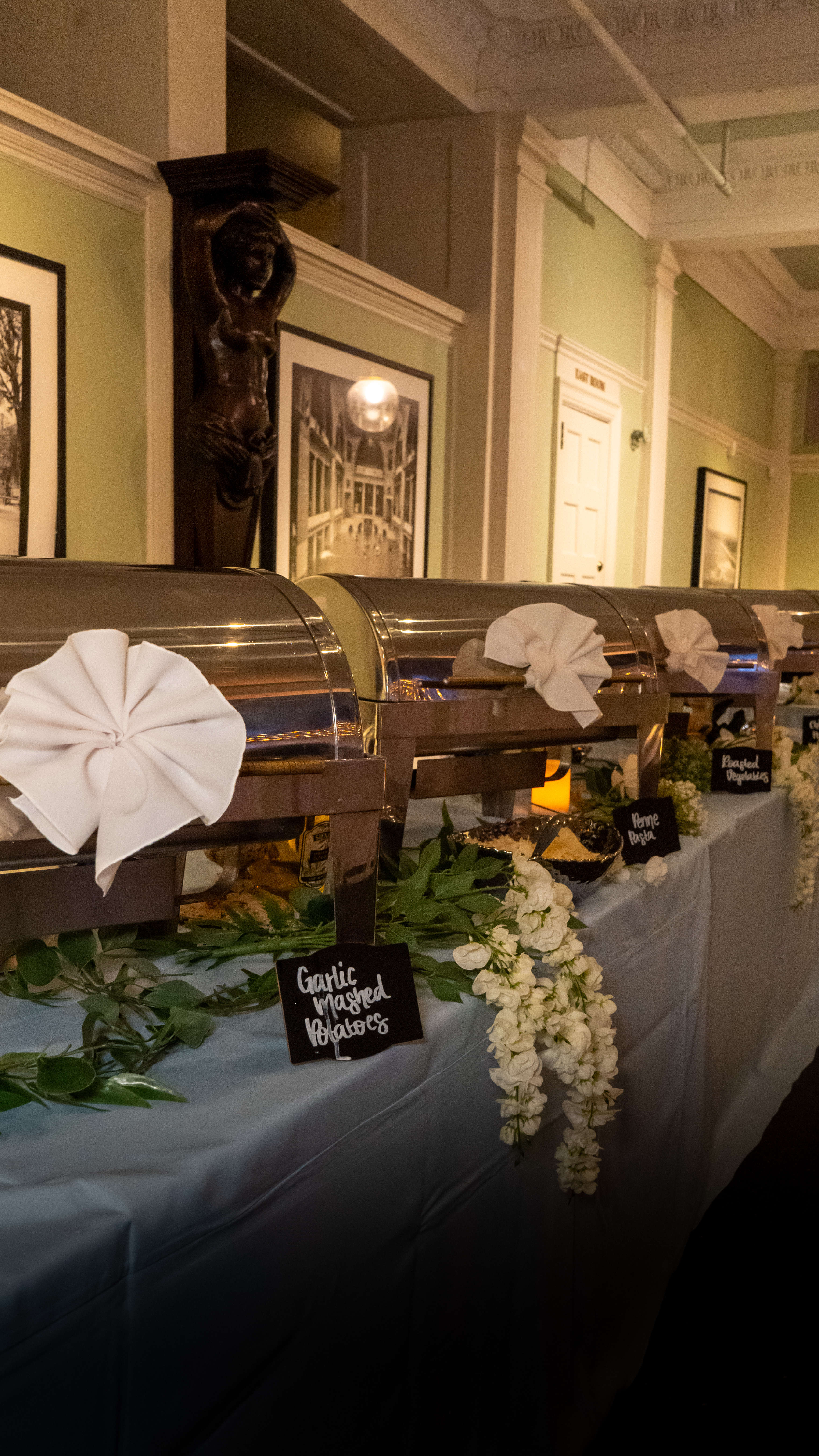 Classic catering buffet setup with chalkboard signs