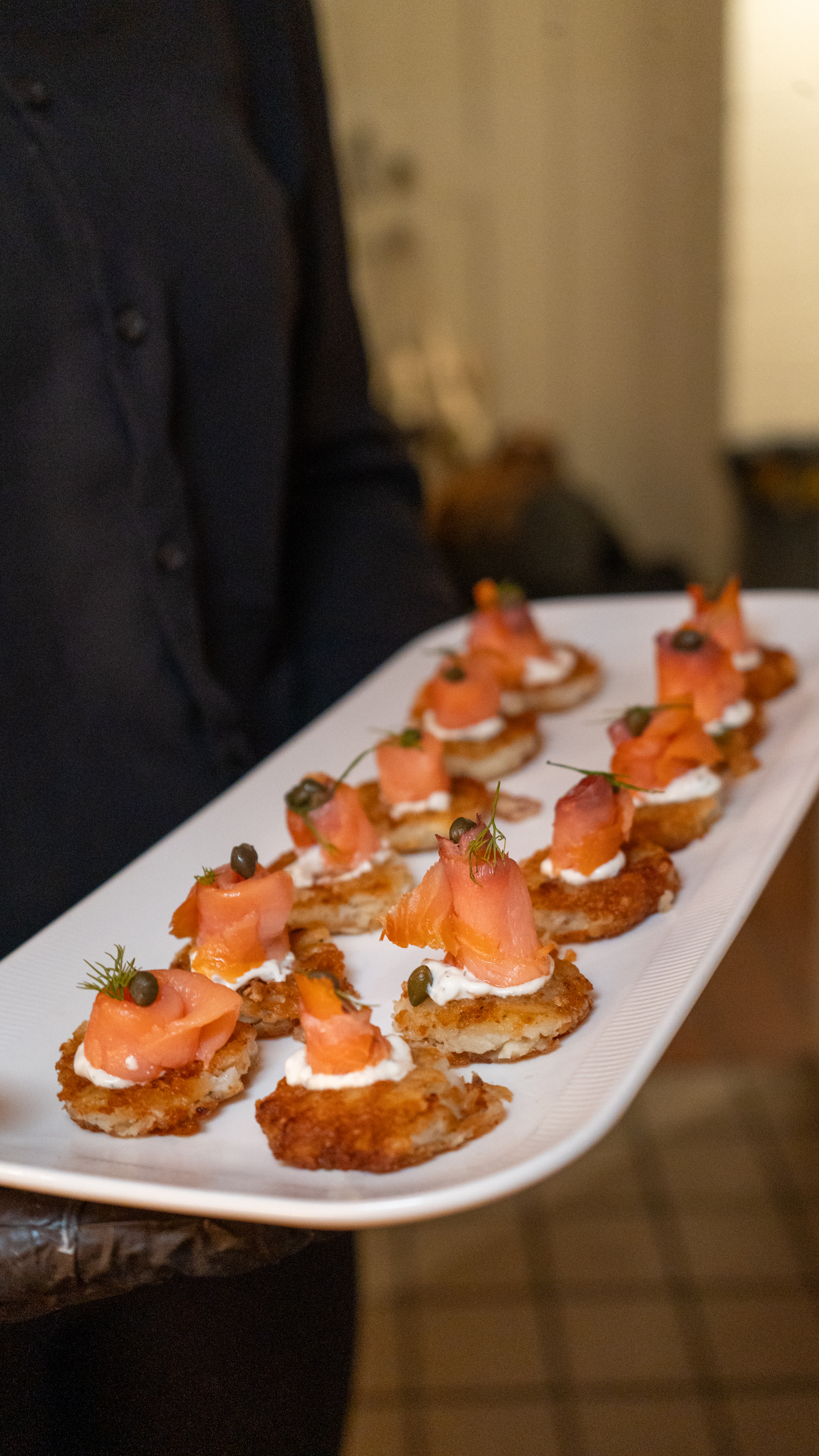 Signature hors d'oeuvres — blinis with salmon and caviar